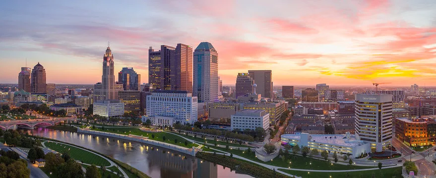 Downtown Columbus at sunset, looking across the Scioto River to the skyline.